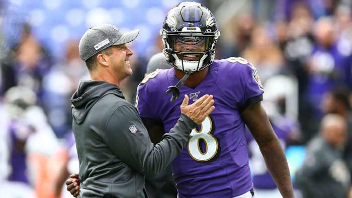 John Harbaugh (L) and Lamar Jackson